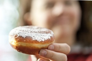 Anne holding a Zingerman's Bakehouse paczki