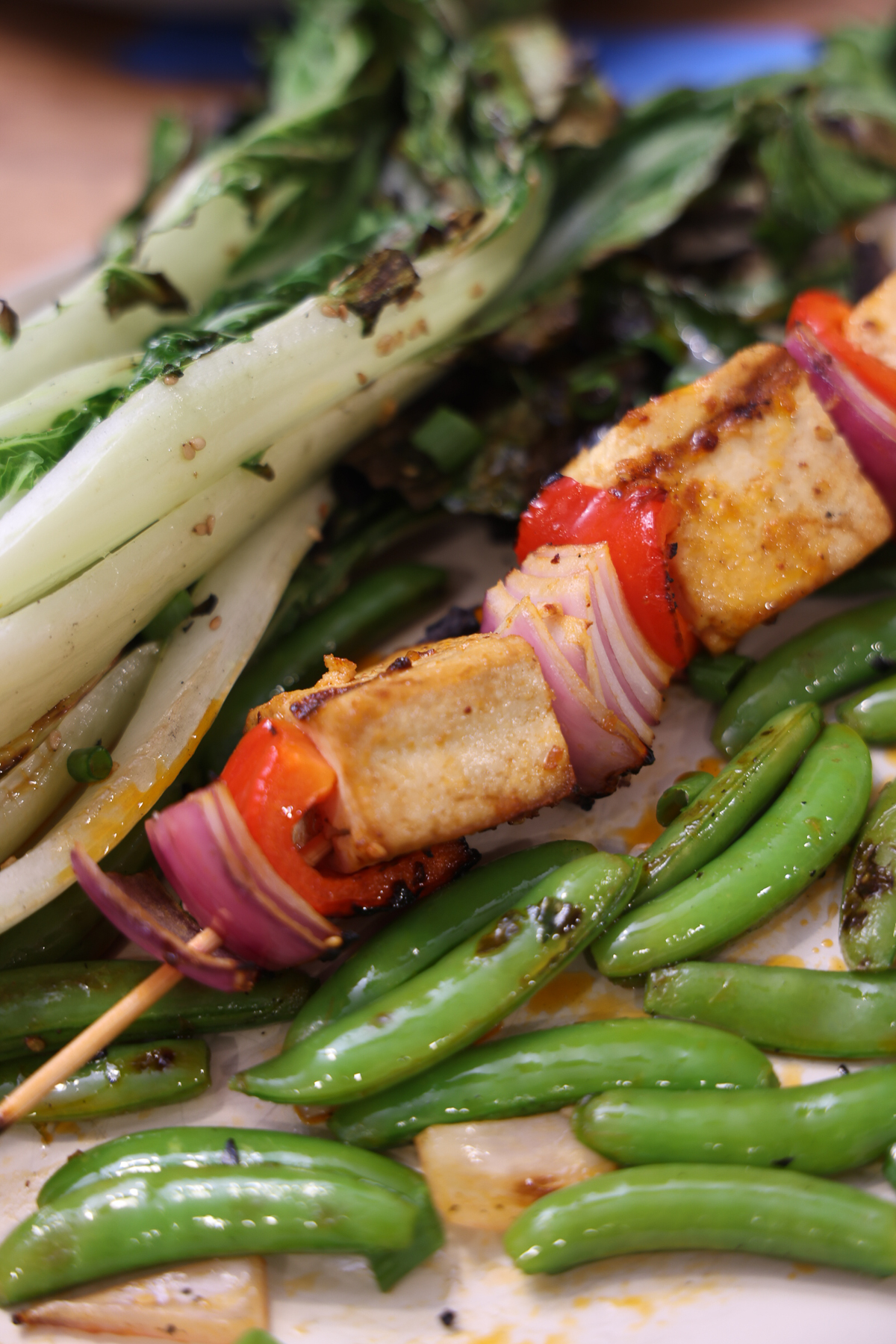 Grilled Tofu Kebabs with Chili Crisp, Snap Peas, and Bok Choy
